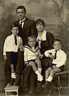Grand parents and three boys in a studio photograph probably taken in Durban where they lived in Brand Road